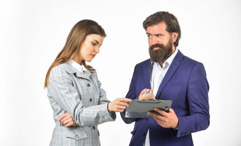 Communication at work. Sometimes partnership is difficult. Business concept. Successful partnership. Couple business meeting. Conflict and rivalry. Risky contract. Man and woman with office document Използване на побутване при събиране на вземания